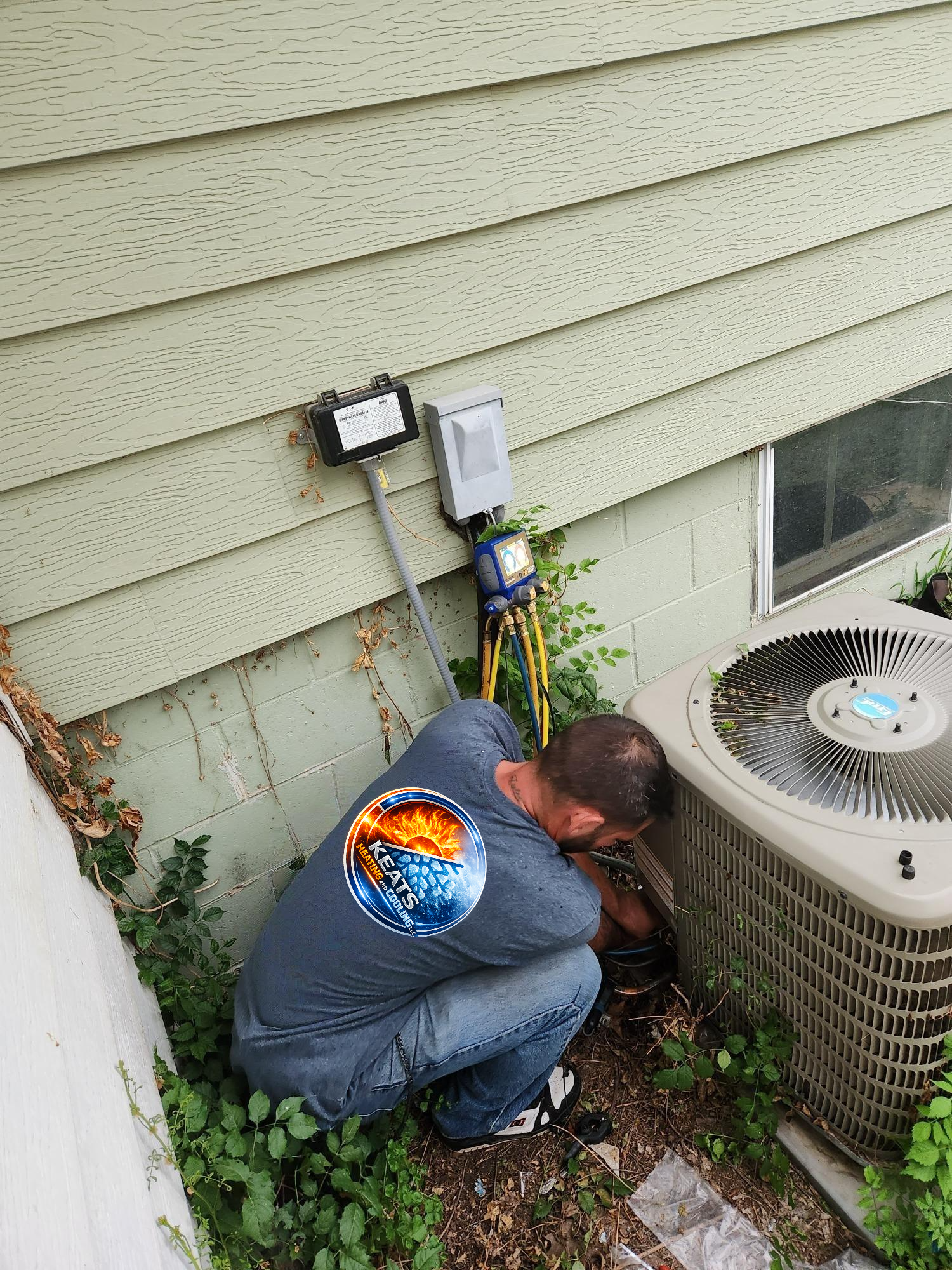HVAC tech servicing an AC that needed repairs